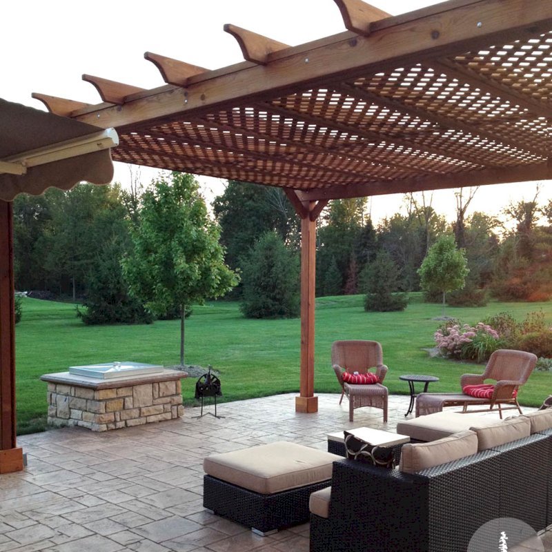 The Traditional Wooden Garden Pergola (Options: 20' L x 16' W, Mature Redwood, No Electrical Wiring Trim, Lattice Roof, Lengthwise Roof Support Timbers, 4-Post Kit for Stone, Brick, or Concrete, No Ceiling Fan Base, No Privacy Panels, No Curtain Rods, 10' Post Height, Transparent Premium Sealant). Photo Courtesy of David Wilson. The Traditional Wooden Garden Pergola (Options: 20' L x 16' W, Mature Redwood, No Electrical Wiring Trim, Lattice Roof, Lengthwise Roof Support Timbers, 4-Post Kit for Stone, Brick, or Concrete, No Ceiling Fan Base, No Privacy Panels, No Curtain Rods, 10' Post Height, Transparent Premium Sealant). Photo Courtesy of David Wilson.