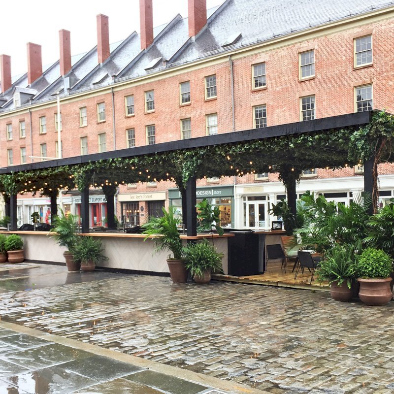The Traditional Wooden Garden Pergola (Options: 82' L x 16' W, Douglas-fir, Open Roof with Rafters at 18", 12-Post Anchor Kit, No Ceiling Fan Base, 12' Post Height, Custom Black Paint). This pergola with polycarbonate roofing is part of the giant popup beer hall at the Southside Seaport in downtown Manhattan from May to Oct 2017: https://www.timeout.com/newyork/blog/a-giant-pop-up-beer-hall-is-opening-at-south-street-seaport-this-summer-032417 The Traditional Wooden Garden Pergola (Options: 82' L x 16' W, Douglas-fir, Open Roof with Rafters at 18", 12-Post Anchor Kit, No Ceiling Fan Base, 12' Post Height, Custom Black Paint). This pergola with polycarbonate roofing is part of the giant popup beer hall at the Southside Seaport in downtown Manhattan from May to Oct 2017: https://www.timeout.com/newyork/blog/a-giant-pop-up-beer-hall-is-opening-at-south-street-seaport-this-summer-032417