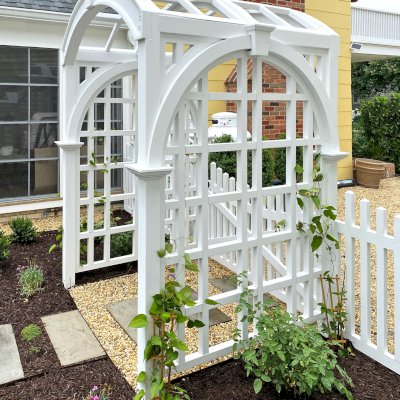 Custom Victorian Trellis (Options: 5' W x 5' D, Douglas-fir, 8' H, 4x4's Posts, Post Anchor Kit for Concrete, Custom Stain) with Custom Fence and Door. Photo Courtesy of Jessica and Brian Steel of Leesburg, Maryland.