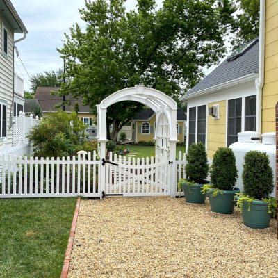 Custom Victorian Trellis (Options: 5' W x 5' D, Douglas-fir, 8' H, 4x4's Posts, Post Anchor Kit for Concrete, Custom Stain) with Custom Fence and Door. Photo Courtesy of Jessica and Brian Steel of Leesburg, Maryland.