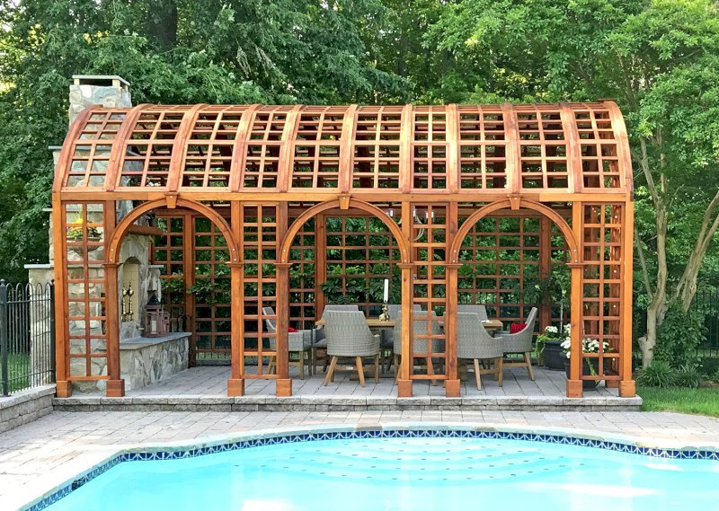 The Victorian Trellis (Options: 22' L x 14' W, Combination of Arcs and Lattice Panels, Mature Redwood, No Rain Guard, 9' Post Height, No Electrical Wiring Trim, 4-Post Anchor Kit for Stone, No Ceiling Fan Base, Transparent Premium Sealant). Photo Courtesy of JR and Trish West of King George, Virginia. The Victorian Trellis (Options: 22' L x 14' W, Combination of Arcs and Lattice Panels, Mature Redwood, No Rain Guard, 9' Post Height, No Electrical Wiring Trim, 4-Post Anchor Kit for Stone, No Ceiling Fan Base, Transparent Premium Sealant). Photo Courtesy of JR and Trish West of King George, Virginia.