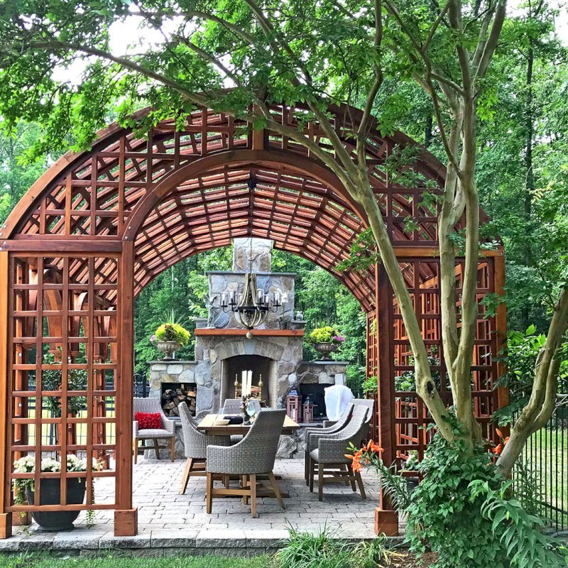The Victorian Trellis (Options: 22' L x 14' W, Combination of Arcs and Lattice Panels, Mature Redwood, No Rain Guard, 9' Post Height, No Electrical Wiring Trim, 4-Post Anchor Kit for Stone, No Ceiling Fan Base, Transparent Premium Sealant). Photo Courtesy of JR and Trish West of King George, Virginia. The Victorian Trellis (Options: 22' L x 14' W, Combination of Arcs and Lattice Panels, Mature Redwood, No Rain Guard, 9' Post Height, No Electrical Wiring Trim, 4-Post Anchor Kit for Stone, No Ceiling Fan Base, Transparent Premium Sealant). Photo Courtesy of JR and Trish West of King George, Virginia.
