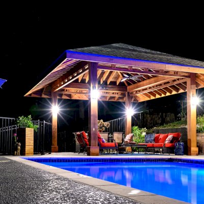 Custom Zen Garden Pavilion (Options: 26ft x 22ft, No Deck & Railings, Mature Redwood, 11' H Posts, with Square 10 x 10 Posts Instead of Rounded, 4 Electrical Wiring Trims, 4 Post High-Wind Anchor Kit, 2 Ceiling Fan Bases, No Curtain Rods, Transparent Premium Sealant). Photo Courtesy of P. Gmerek of Wildwood, Missouri.