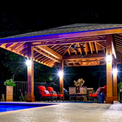 Custom Zen Garden Pavilion (Options: 26ft x 22ft, No Deck & Railings, Mature Redwood, 11' H Posts, with Square 10 x 10 Posts Instead of Rounded, 4 Electrical Wiring Trims, 4 Post High-Wind Anchor Kit, 2 Ceiling Fan Bases, No Curtain Rods, Transparent Premium Sealant). Photo Courtesy of P. Gmerek of Wildwood, Missouri.