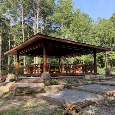 The Zen Garden Pavilion (Options: 32ft x 32ft with Deck & Railings, Mature Redwood, Without Fascia Board for Gutters, No Electrical Wiring Trim, 4 post high-wind anchor kit, Add a Ceiling Fan Base, No Curtain Rods, Transparent Premium Sealant).