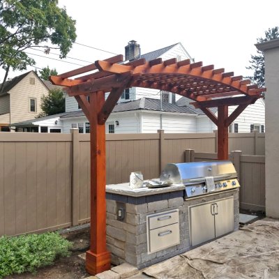 Two-Post Arched Wood Arbor (Options: 12' x 4', California Redwood, 6" x 6" Posts and 2" x 6" Roof Timbers, 9ft H, 2-Post anchor Kit for High-Wind, No Privacy Panel, Transparent Premium Sealant). Photo Courtesy of J. Lyons of Columbus, CA.