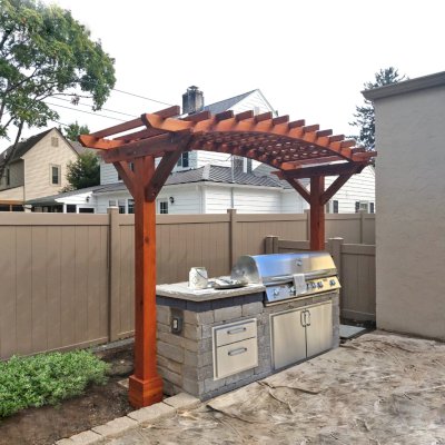 Two-Post Arched Wood Arbor (Options: 12' x 4', California Redwood, 6" x 6" Posts and 2" x 6" Roof Timbers, 9ft H, 2-Post anchor Kit for High-Wind, No Privacy Panel, Transparent Premium Sealant). Photo Courtesy of J. Lyons of Columbus, CA.