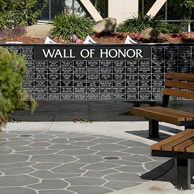 Veterans Wood Bench (Options: 4 ft, Old Growth Redwood, Bolt Down Legs, No Cushion, No Engraving, Coffee-Stain Premium Sealant).  Photo Courtesy of Veteran's Administration Hospital in Fresno, CA.