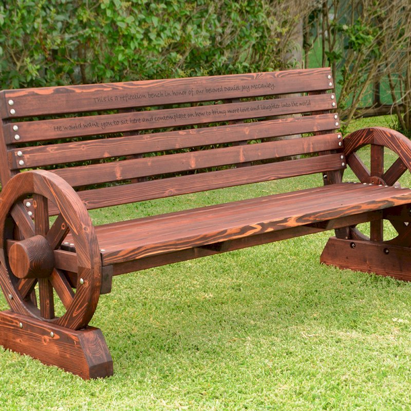 Wagon Wheel Bench (Options. 6 ft, Mature Redwood (20-yr Warranty) , No Cushion, Custom Engraving - 51-100 chars, Cherry Stain Premium Sealant). Wagon Wheel Bench (Options. 6 ft, Mature Redwood (20-yr Warranty) , No Cushion, Custom Engraving - 51-100 chars, Cherry Stain Premium Sealant).