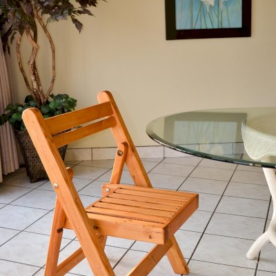 Wooden folding chair with cushion clearance
