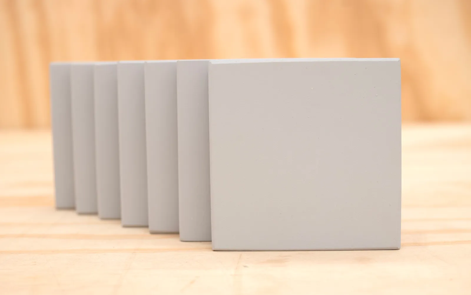 Gray Oil-Based Primer on the 7 wood grades
