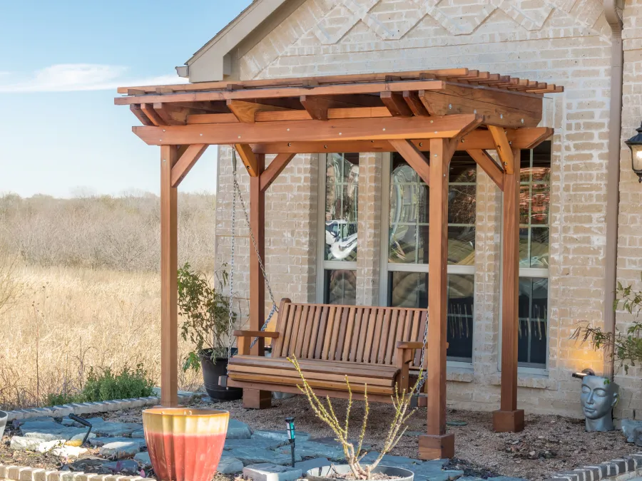 Angel's Trellis Swing (Options: 9' x 6', California Redwood, with Rain Guard, Classic Design Seat, 7.5' Posts by Custom Request, Post Anchoring for Concrete, Transparent Premium Sealant). Photo Courtesy of C. Edwards of Fort Worth, TX.