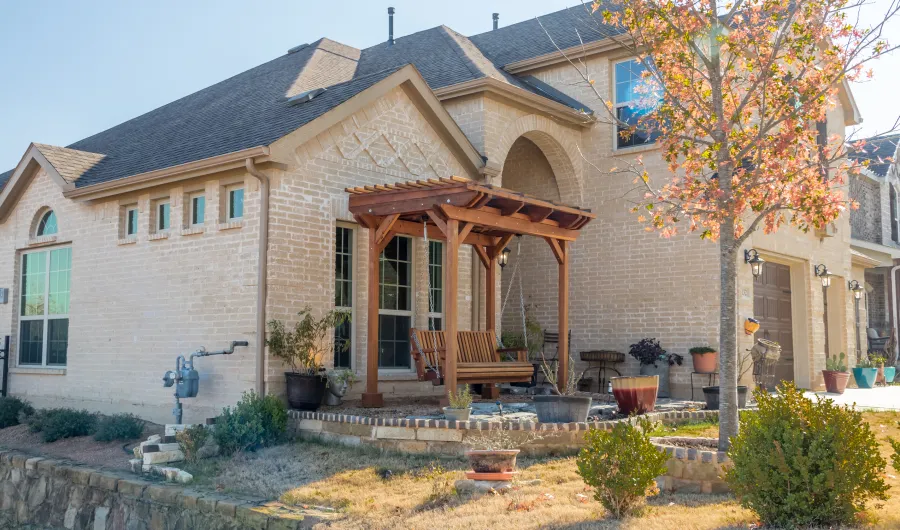 Angel's Trellis Swing (Options: 9' x 6', California Redwood, with Rain Guard, Classic Design Seat, 7.5' Posts by Custom Request, Post Anchoring for Concrete, Transparent Premium Sealant). Photo Courtesy of C. Edwards of Fort Worth, TX.