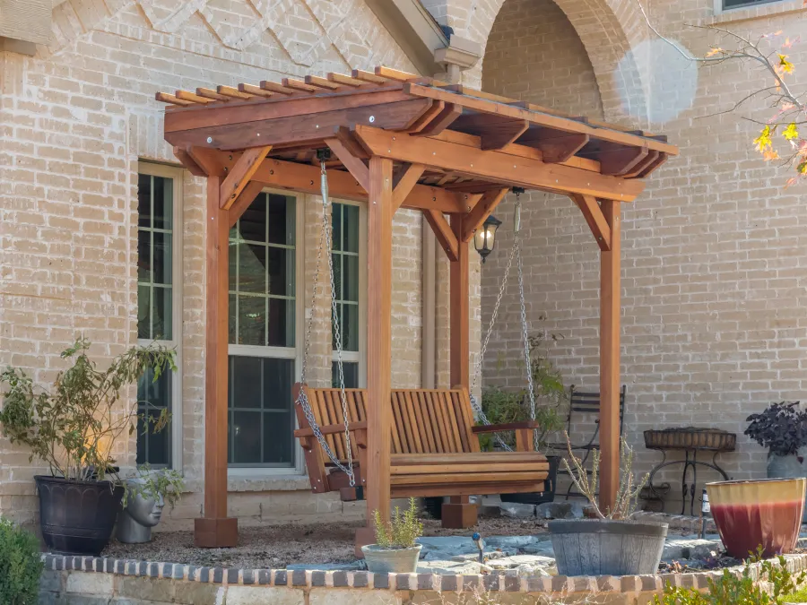 Angel's Trellis Swing (Options: 9' x 6', California Redwood, with Rain Guard, Classic Design Seat, 7.5' Posts by Custom Request, Post Anchoring for Concrete, Transparent Premium Sealant). Photo Courtesy of C. Edwards of Fort Worth, TX.
