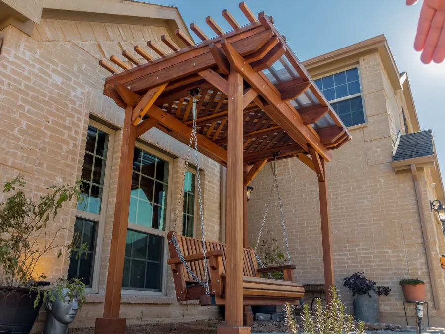 Angel's Trellis Swing (Options: 9' x 6', California Redwood, with Rain Guard, Classic Design Seat, 7.5' Posts by Custom Request, Post Anchoring for Concrete, Transparent Premium Sealant). Photo Courtesy of C. Edwards of Fort Worth, TX.