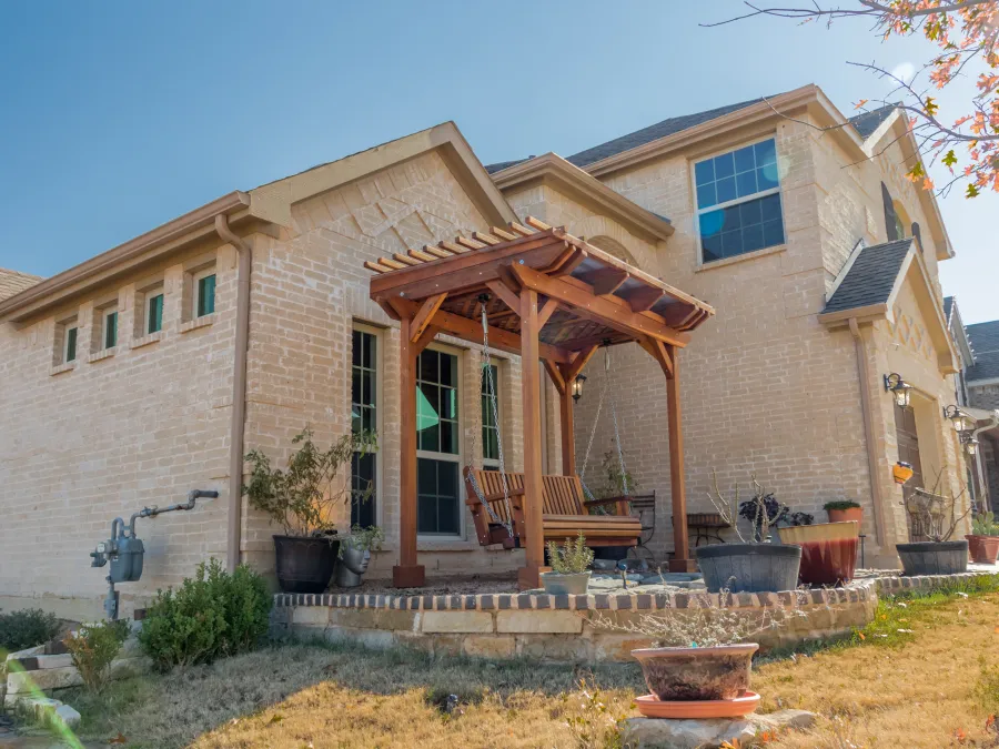 Angel's Trellis Swing (Options: 9' x 6', California Redwood, with Rain Guard, Classic Design Seat, 7.5' Posts by Custom Request, Post Anchoring for Concrete, Transparent Premium Sealant). Photo Courtesy of C. Edwards of Fort Worth, TX.