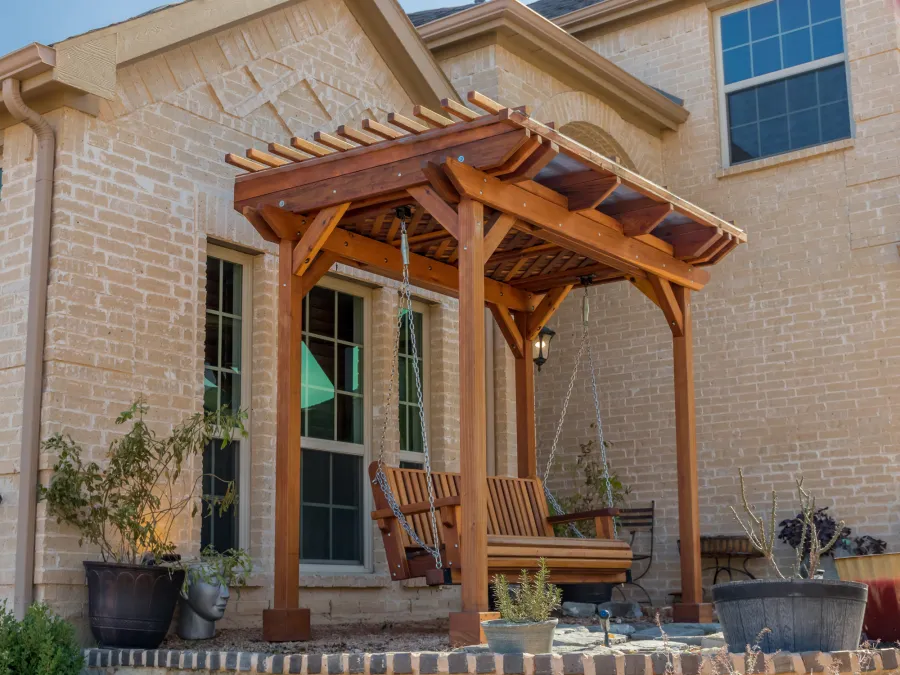 Angel's Trellis Swing (Options: 9' x 6', California Redwood, with Rain Guard, Classic Design Seat, 7.5' Posts by Custom Request, Post Anchoring for Concrete, Transparent Premium Sealant). Photo Courtesy of C. Edwards of Fort Worth, TX.