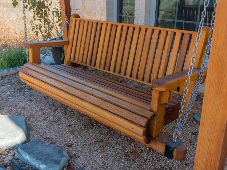 Angel's Trellis Swing (Options: 9' x 6', California Redwood, with Rain Guard, Classic Design Seat, 7.5' Posts by Custom Request, Post Anchoring for Concrete, Transparent Premium Sealant). Photo Courtesy of C. Edwards of Fort Worth, TX.