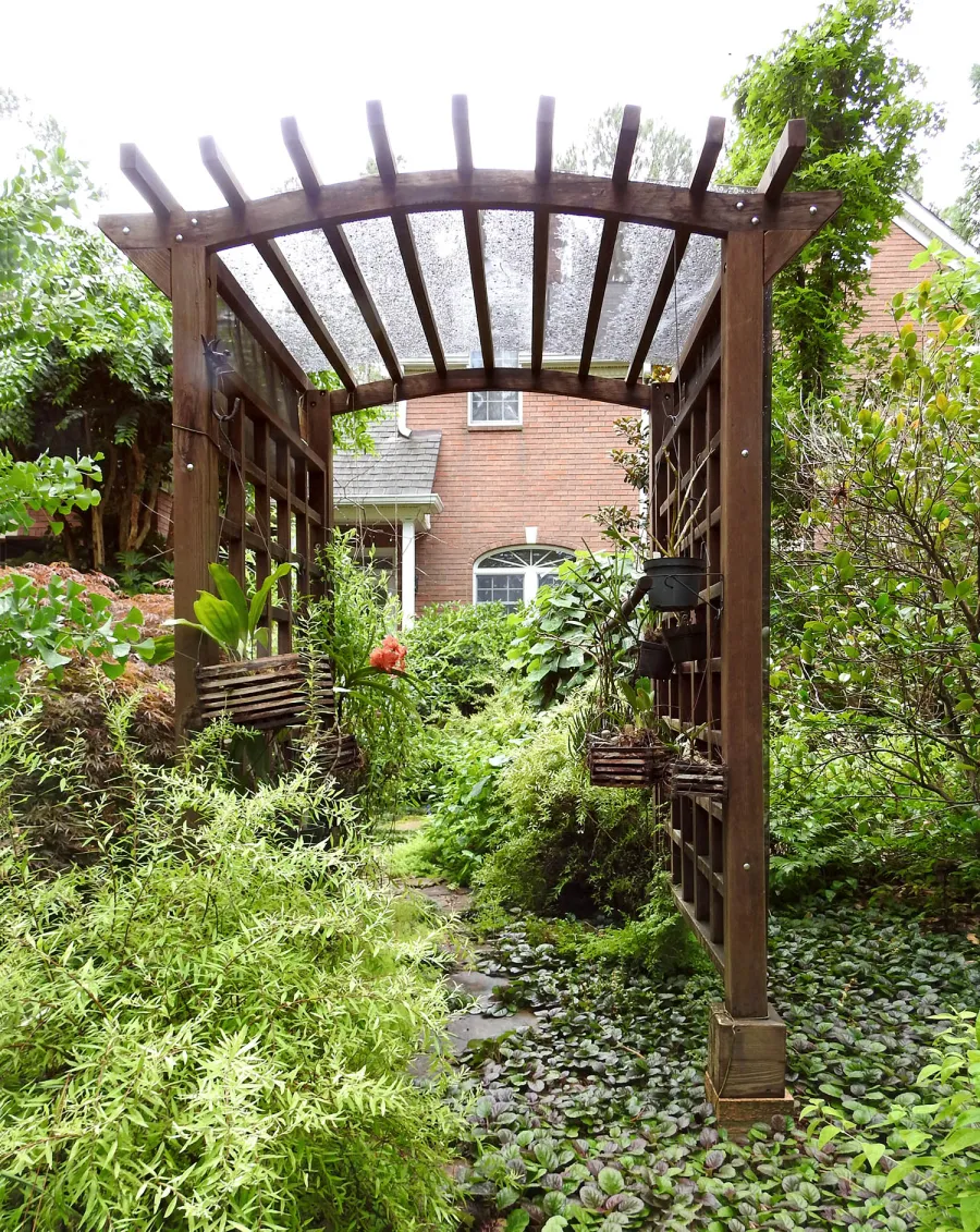 Arched Garden Arbor (Options: 48" W x 60" D, Mature Redwood, Anchor Kit for Concrete, Transparent Premium Sealant). Photo Courtesy of S. Fly of Millsboro, Delaware.