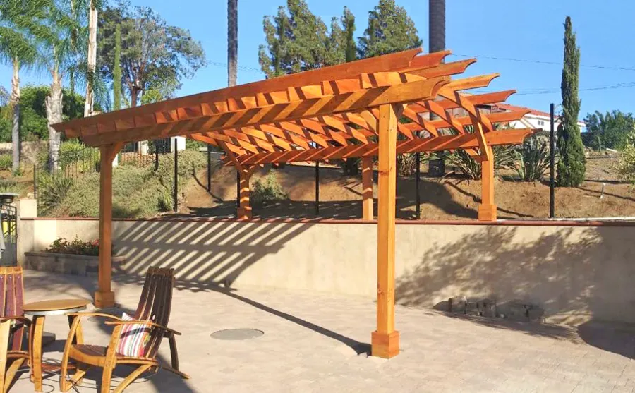 Arched Open Sky Pergolas (Options: 22' L x 15' Arc W, Douglas-fir, No Electrical Wiring Trims, 4-Post Anchor Kit for Concrete, 2' Overhangs by Custom Request, No Ceiling Fan Base, No Privacy Panels, No Curtain Rods, 2 Posts are 10' H and the Posts on the Pony Wall are 5' H, Transparent Premium Sealant). Photo Courtesy of J. Marca of Escondido, California.