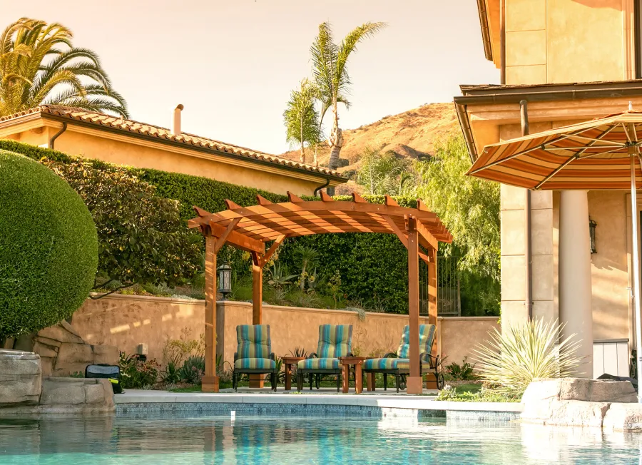 Arched Open Sky PergolaArched Open Sky Pergolas (Options: 11' L x 13' Arc W, Mature Redwood, Unattached, No Electrical Wiring Trim, 4-Post Anchor Kit for Concrete, No Ceiling Fan Base, No Privacy Panels, No Curtain Rods, 9' Post Height, Transparent Premium Sealant). Photo courtesy of G. Gigante of Glendora, CA.