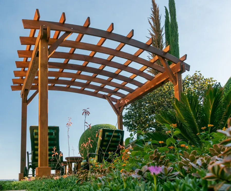 Arched Open Sky PergolaArched Open Sky Pergolas (Options: 11' L x 13' Arc W, Mature Redwood, Unattached, No Electrical Wiring Trim, 4-Post Anchor Kit for Concrete, No Ceiling Fan Base, No Privacy Panels, No Curtain Rods, 9' Post Height, Transparent Premium Sealant). Photo courtesy of G. Gigante of Glendora, CA.