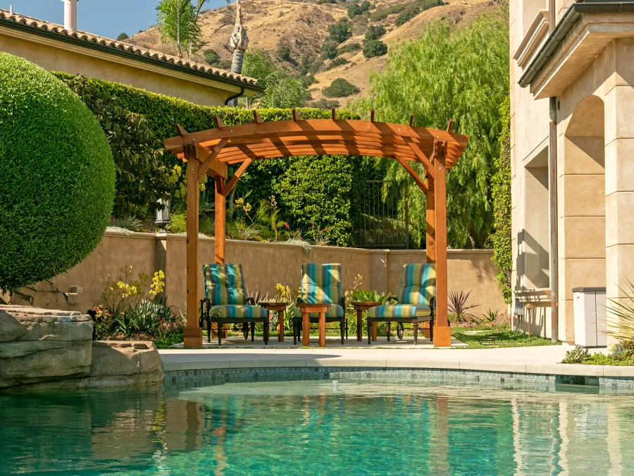 Arched Open Sky PergolaArched Open Sky Pergolas (Options: 11' L x 13' Arc W, Mature Redwood, Unattached, No Electrical Wiring Trim, 4-Post Anchor Kit for Concrete, No Ceiling Fan Base, No Privacy Panels, No Curtain Rods, 9' Post Height, Transparent Premium Sealant). Photo courtesy of G. Gigante of Glendora, CA.