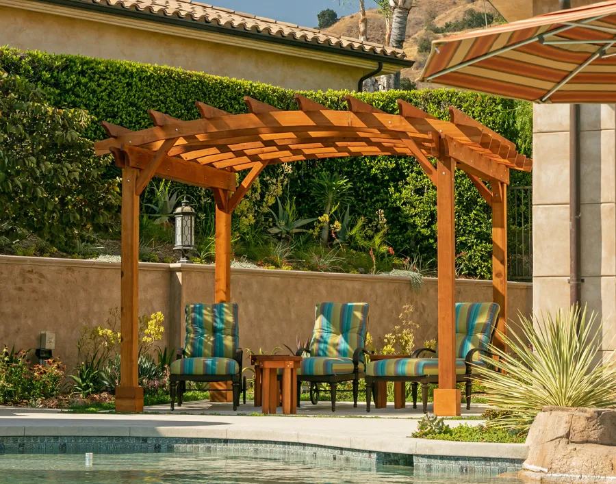 Arched Open Sky PergolaArched Open Sky Pergolas (Options: 11' L x 13' Arc W, Mature Redwood, Unattached, No Electrical Wiring Trim, 4-Post Anchor Kit for Concrete, No Ceiling Fan Base, No Privacy Panels, No Curtain Rods, 9' Post Height, Transparent Premium Sealant). Photo courtesy of G. Gigante of Glendora, CA.