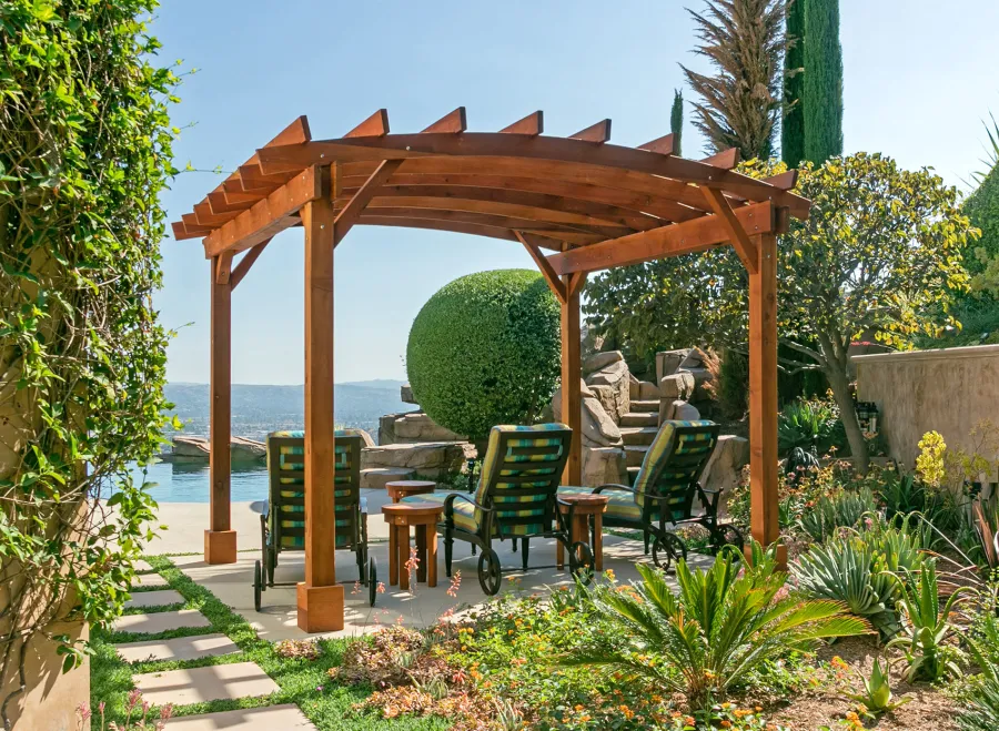 Arched Open Sky PergolaArched Open Sky Pergolas (Options: 11' L x 13' Arc W, Mature Redwood, Unattached, No Electrical Wiring Trim, 4-Post Anchor Kit for Concrete, No Ceiling Fan Base, No Privacy Panels, No Curtain Rods, 9' Post Height, Transparent Premium Sealant). Photo courtesy of G. Gigante of Glendora, CA.