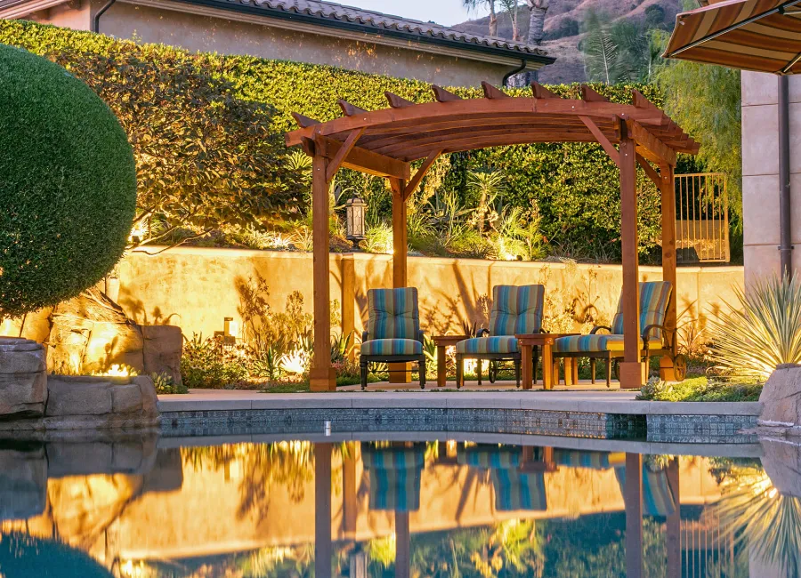 Arched Open Sky PergolaArched Open Sky Pergolas (Options: 11' L x 13' Arc W, Mature Redwood, Unattached, No Electrical Wiring Trim, 4-Post Anchor Kit for Concrete, No Ceiling Fan Base, No Privacy Panels, No Curtain Rods, 9' Post Height, Transparent Premium Sealant). Photo courtesy of G. Gigante of Glendora, CA.