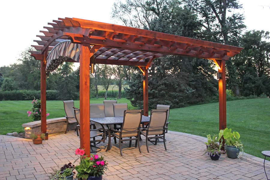 Arched Open Sky Pergolas (Options: 14' L x 14' Arc W, California Redwood, Unattached, Electrical Wiring Trim for 2 Posts, Arched Roof without Lattice Panels, 4-Post Anchor Kit for Concrete, No Ceiling Fan Base, No Privacy Panels, No Curtain Rods, 9' Post Height, Transparent Premium Sealant). 18" Overhang of Arches. Ends of arches with Same Roosevelt End Detail Work as Have the Supports and Slats. Pergola Installed in 2014. Photo Courtesy of J. Martin of Morgantown, Pennsylvania.