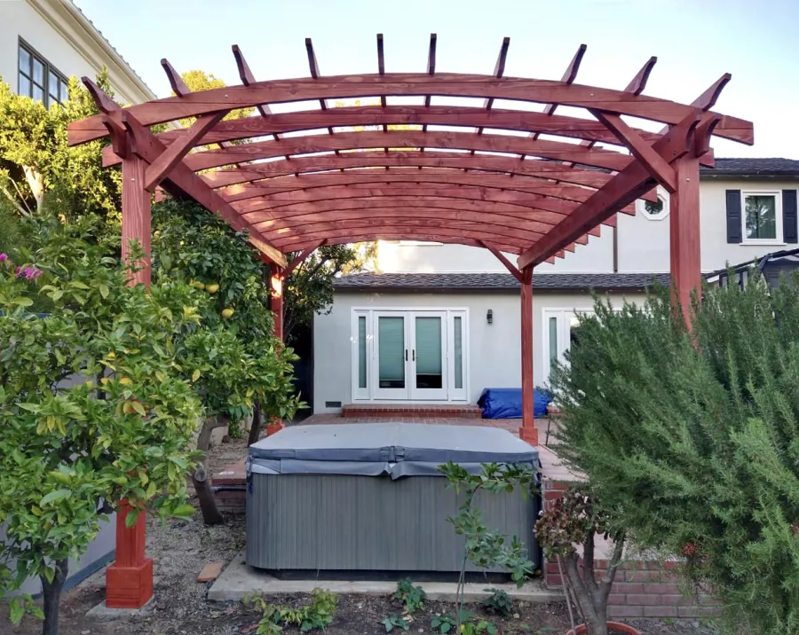 Arched Open Sky Pergolas (Options: 18' L x 15' Arc W, Douglas-fir, 2 Electrical Wiring Trims, 4-Post Anchor Kit for Concrete, No Ceiling Fan Base, No Privacy Panels, No Curtain Rods, 9' Post Height, Custom Stain). Photo Courtesy of K. Jefferson of Santa Monica, CA.