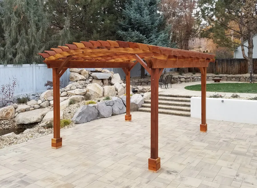 Arched Open Sky Pergolas (Options: 15' L x 14' Arc W, California Redwood, 1 Electrical Wiring Trim, 4-Post Anchor Kit for High-Wind, 1 Ceiling Fan Base, No Privacy Panels, No Curtain Rods, 9' Post Height, Transparent Premium Sealant). Photo Courtesy of D. Cozzi of Reno, Nevada.