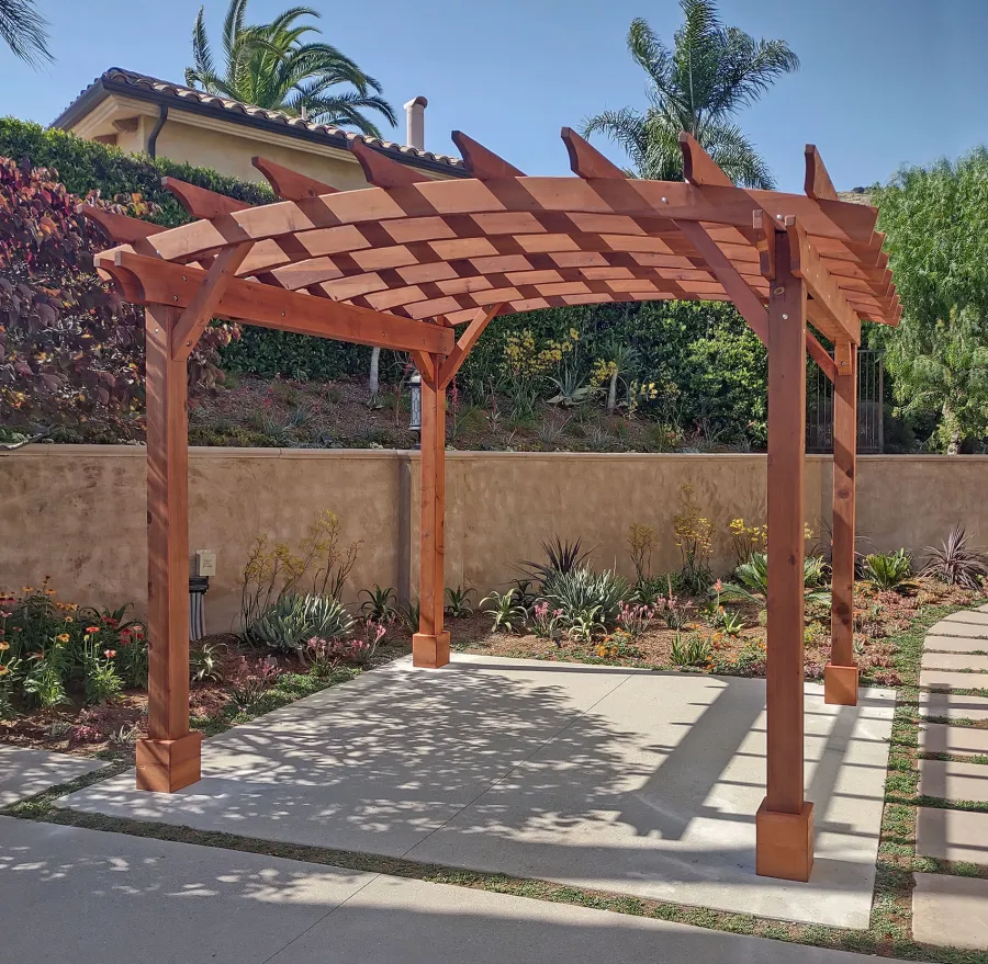 Arched Open Sky PergolaArched Open Sky Pergolas (Options: 11' L x 13' Arc W, Mature Redwood, Unattached, No Electrical Wiring Trim, 4-Post Anchor Kit for Concrete, No Ceiling Fan Base, No Privacy Panels, No Curtain Rods, 9' Post Height, Transparent Premium Sealant). Photo courtesy of G. Gigante of Glendora, CA.