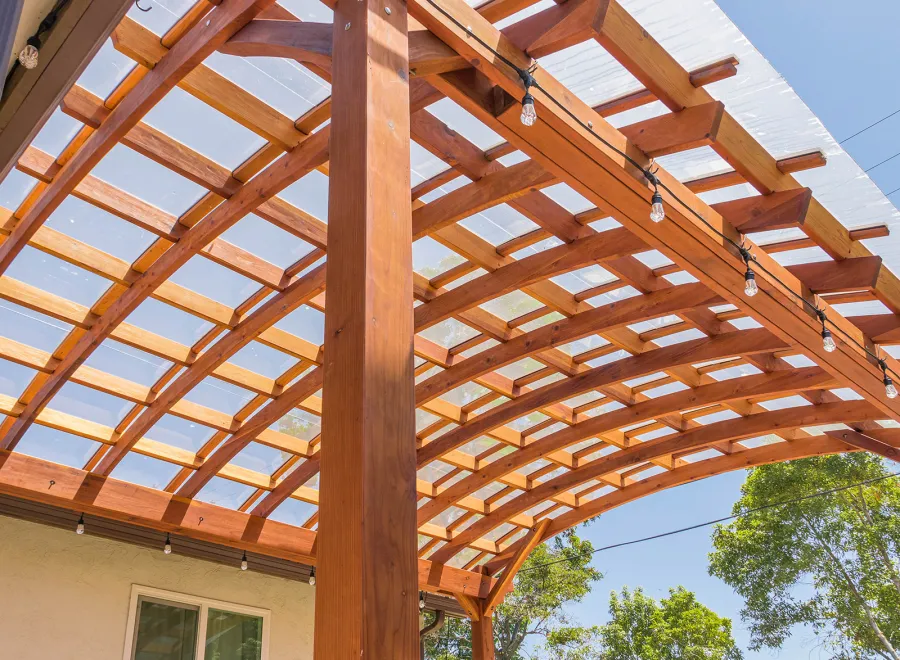 Arched Open Sky Pergolas (Options: 18' L x 16' Arc W, California Redwood, with Rain Guard, Electrical Wiring Trim for All Posts, 4-Post Anchor Kit for Concrete, No Ceiling Fan Base, No Privacy Panels, No Curtain Rods, 9.5' Post Height, Transparent Premium Sealant).