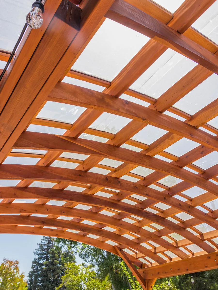Arched Open Sky Pergolas (Options: 18' L x 16' Arc W, California Redwood, with Rain Guard, Electrical Wiring Trim for All Posts, 4-Post Anchor Kit for Concrete, No Ceiling Fan Base, No Privacy Panels, No Curtain Rods, 9.5' Post Height, Transparent Premium Sealant).