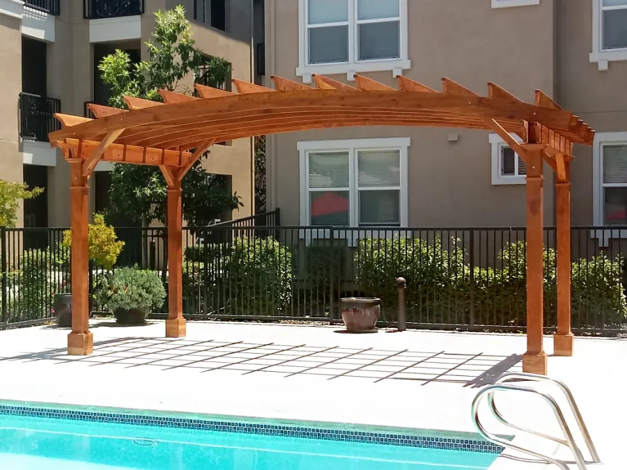 Arched Open Sky Pergolas (Options: 10' L x 20' Arc W, California Redwood, No Electrical Wiring Trim, Horizontal Decorative Trims on Posts, 4-Post Anchor Kit for Concrete, No Ceiling Fan Base, No Privacy Panels, No Curtain Rods, 9' Post Height, Transparent Premium Sealant). Photo Courtesy of M. Castaneda of Pleasanton, CA.