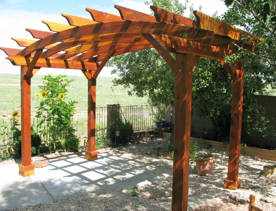 Arched Open Sky Pergolas (Custom Options: 8' L x 14' Arc W, California Redwood, Unattached, No Electrical Wiring Trim, Arched Roof without Lattice Panels, 4-Post Anchor kit for Stone, No Ceiling Fan Base, No Privacy Panels, No Curtain Rods, 10' Post Height, Transparent Premium Sealant). Photo Courtesy of Pat P. of Prescott Valley, Arizona.