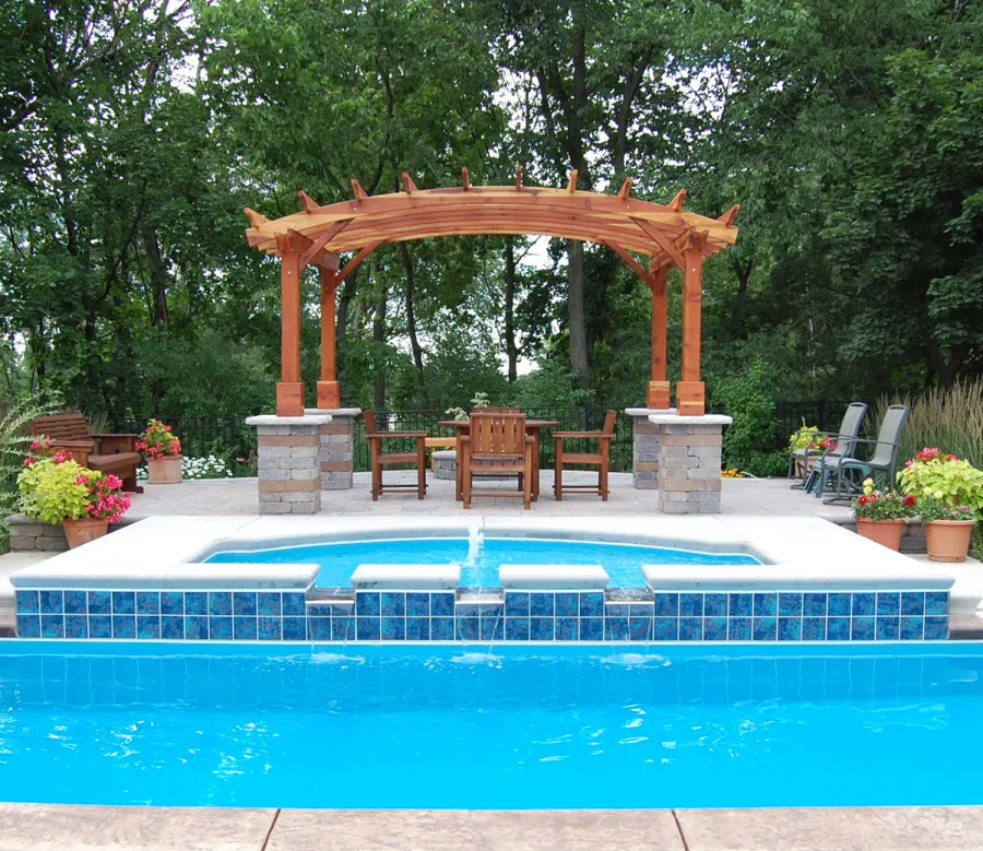 Arched Open Sky Pergolas (Options: 10' L x 14' Arc W, California Redwood, Unattached, No Electrical Wiring Trim, Arched Roof Without Lattice Panels, 4-Post Anchor Kit for Stone, No Ceiling Fan Base, No Privacy Panels, No Curtain Rods, Custom Post Height, Transparent Premium Sealant). Photo Courtesy of Glen Vick of Lafayette, IN. Table set under Pergola not built by Forever Redwood.