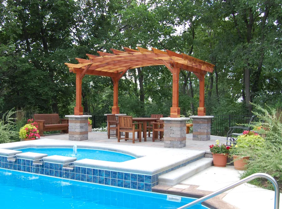 Arched Open Sky Pergolas (Options: 10' L x 14' Arc W, California Redwood, Unattached, No Electrical Wiring Trim, Arched Roof Without Lattice Panels, 4-Post Anchor Kit for Stone, No Ceiling Fan Base, No Privacy Panels, No Curtain Rods, Custom Post Height, Transparent Premium Sealant). Photo Courtesy of Glen Vick of Lafayette, IN. Table set under Pergola not built by Forever Redwood.