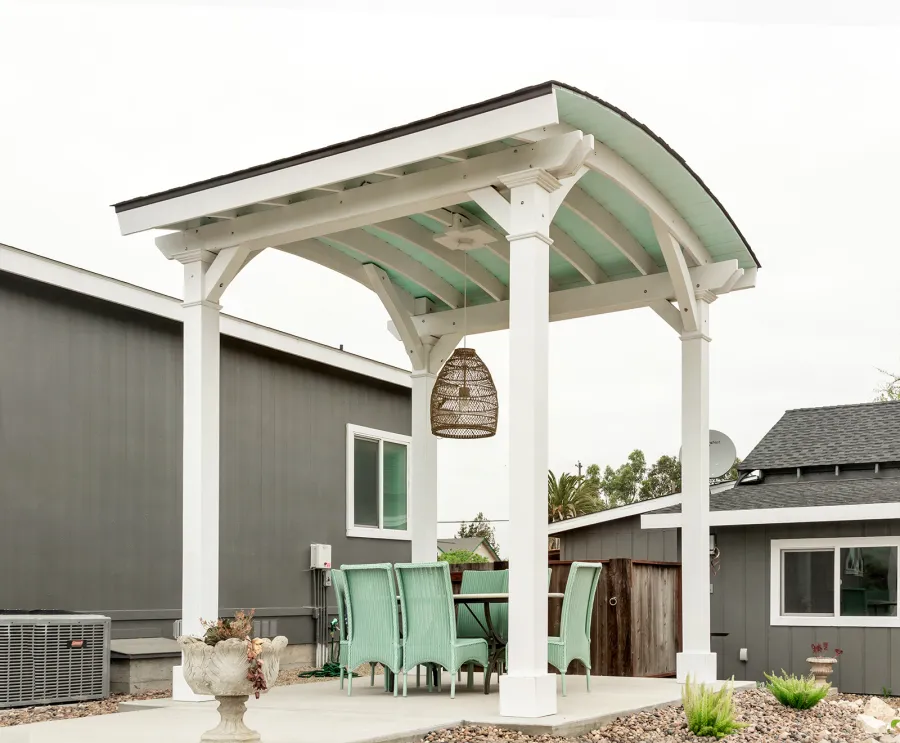  Arched Thick Timber Pavilion (Options: 12' L x 12' Arc W, Douglas-fir, 1 Electrical Wiring Trim, 4-Post Anchor Kit for Concrete, 1 Ceiling Fan Base, No Privacy Panel, No Curtain Rods, 12 ft H, Horizontal Decorative Trims on Posts, Custom Paint). Photo Courtesy of Siino Ventures of Kikrland, Washington.