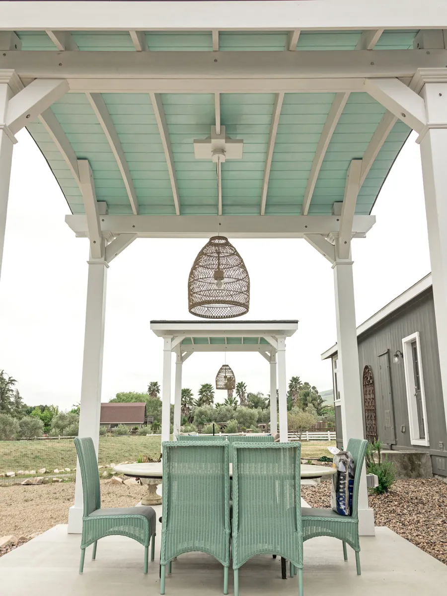  Arched Thick Timber Pavilion (Options: 12' L x 12' Arc W, Douglas-fir, 1 Electrical Wiring Trim, 4-Post Anchor Kit for Concrete, 1 Ceiling Fan Base, No Privacy Panel, No Curtain Rods, 12 ft H, Horizontal Decorative Trims on Posts, Custom Paint). Photo Courtesy of Siino Ventures of Kikrland, Washington.