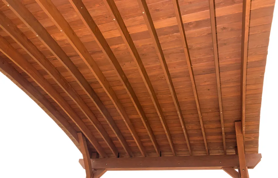Custom Arched Thick Timber Pavilion (Options: 14' L x 20' Arc W, Mature Redwood, 1 Electrical Wiring Trim, 4-Post Anchor Kit for Concrete, No Ceiling Fan Base, No Privacy Panel, No Curtain Rods, 9 ft H, with 2x6's Roof Boards by Custom Request, Coffee-Stain Premium Sealant). Photo Courtesy of Siino Ventures of Kikrland, Washington.