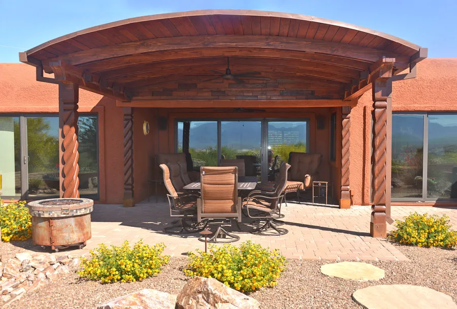 Custom Arched Thick Timber Pavilion (Options: 14' L x 18' Arc W, Douglas-fir, Attached, No Electrical Wiring Trim, No Posts, Pavilion Roof Installed on Existing Load Bearing Columns [Manufactured by https://southwestspiraldesigns.com], No Ceiling Fan Base, No Privacy Panel, No Curtain Rods, 10ft H, Coffee-Stain Premium Sealant). Photo Courtesy of R. Gatz of Green Valley, Arizona.
