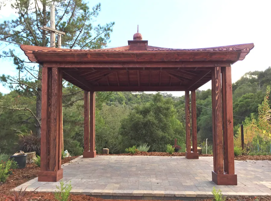 Asian Fusion Pavilion (Options: 18 ft L x 18 ft W, Douglas-fir, 4-Traditional Asian Fusion Anchoring Set, No Electrical Wiring Trim, 10 ft H, No Ceiling Fan, No Privacy Panels, No Curtain Rods, Coffee-Stain Premium Sealant). Photo Courtesy of M. Chadha of Saratoga, CA.