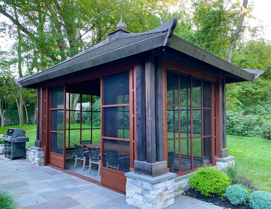 Asian Fusion Pavilion (Options: 22 ft L x 16 ft W, Mature Redwood, 4-Traditional Asian Fusion Anchoring Set, No Electrical Wiring Trim, 10 ft H, No Ceiling Fan, No Privacy Panels, No Curtain Rods, Coffee-Stain Sealant). Custom Screens Added: Customer called 5 years after original order was installed to add screens all around. You can see the different finish between the newly added screens and the original structure.
