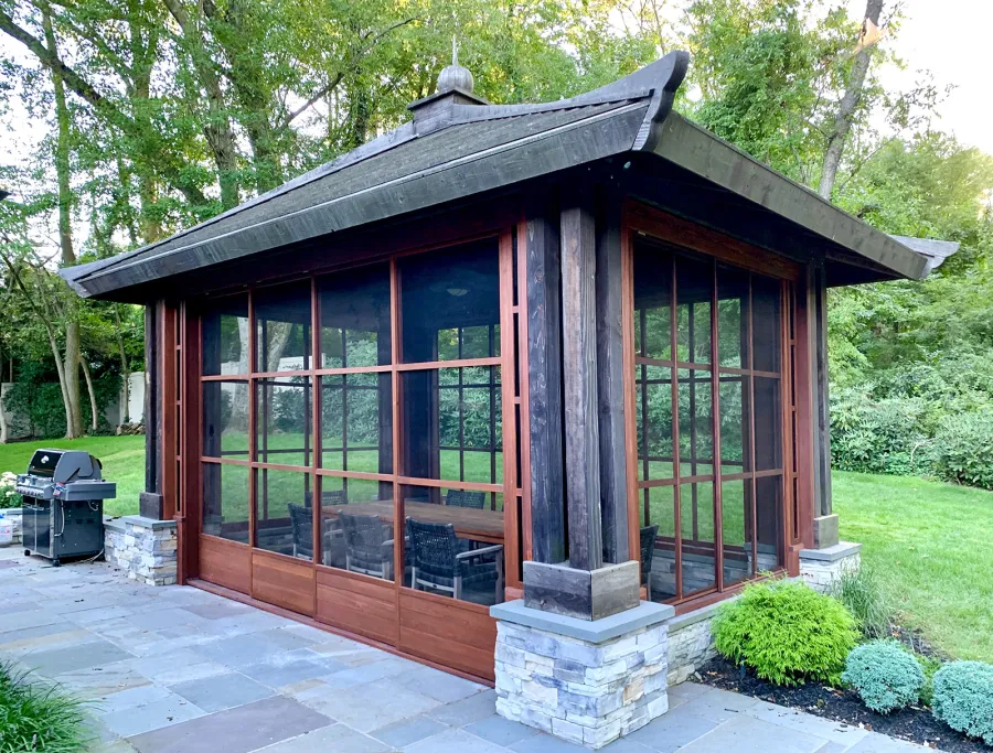 Asian Fusion Pavilion (Options: 22 ft L x 16 ft W, Mature Redwood, 4-Traditional Asian Fusion Anchoring Set, No Electrical Wiring Trim, 10 ft H, No Ceiling Fan, No Privacy Panels, No Curtain Rods, Coffee-Stain Sealant). Custom Screens Added: Customer called 5 years after original order was installed to add screens all around. You can see the different finish between the newly added screens and the original structure.