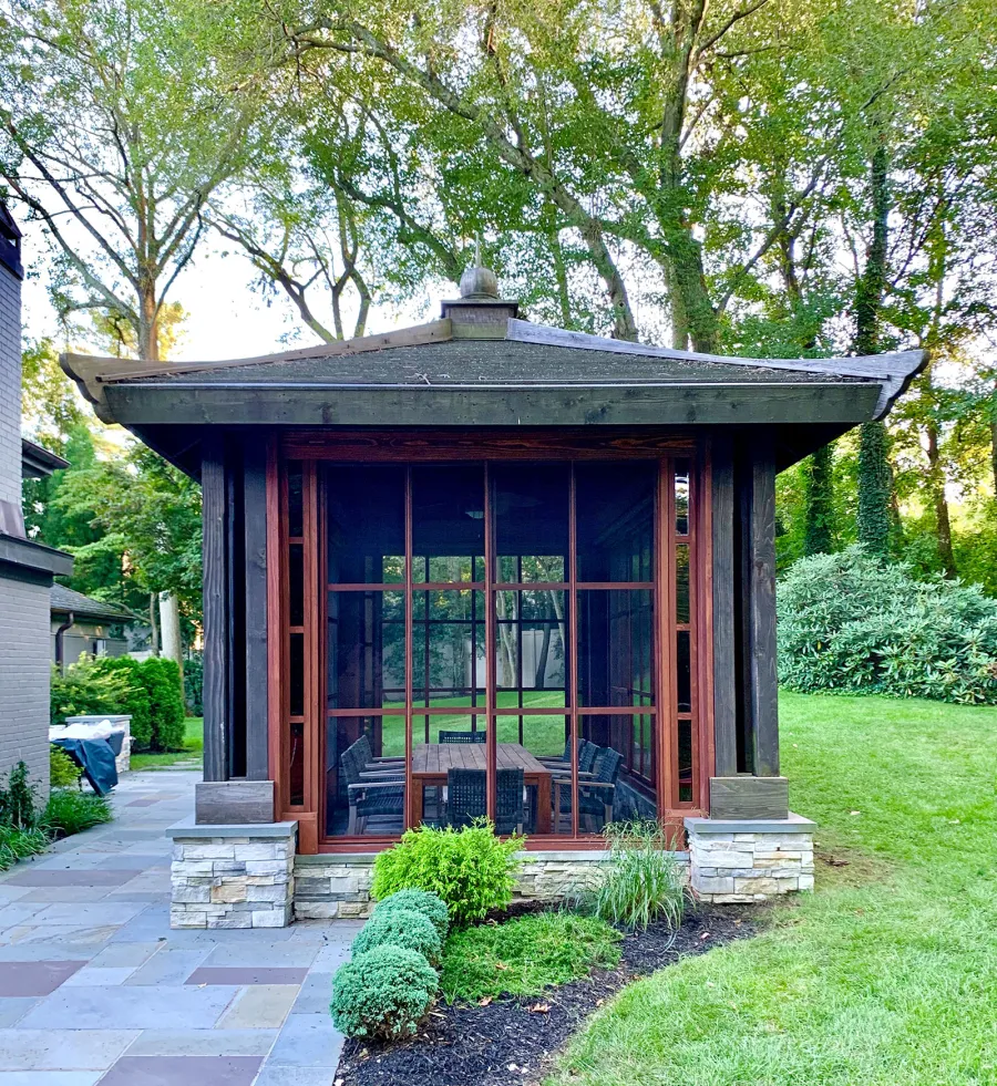 Asian Fusion Pavilion (Options: 22 ft L x 16 ft W, Mature Redwood, 4-Traditional Asian Fusion Anchoring Set, No Electrical Wiring Trim, 10 ft H, No Ceiling Fan, No Privacy Panels, No Curtain Rods, Coffee-Stain Sealant). Custom Screens Added: Customer called 5 years after original order was installed to add screens all around. You can see the different finish between the newly added screens and the original structure.