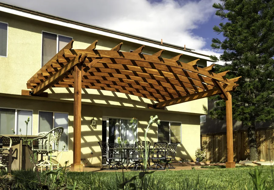 Attached Arched Pergola Kits (Options: 20' L x 15' W, California Redwood, No Electrical Wiring Trim, Arched Roof without Lattice Panels, 2-Post Anchor Kit for Concrete, No Ceiling Fan Base, No Privacy Panels, No Curtain Rods, 10' Post Height, Transparent Premium Sealant). Photo Courtesy of C. Thompson of Corona, CA.