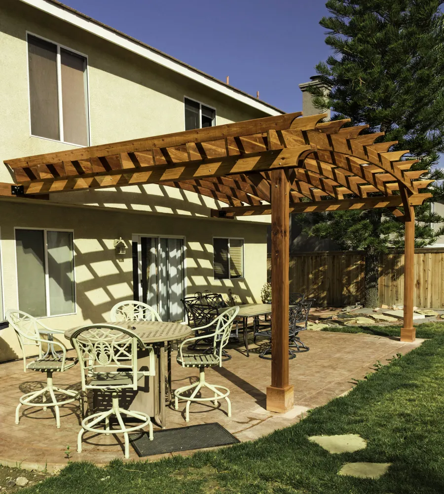 Attached Arched Pergola Kits (Options: 20' L x 15' W, California Redwood, No Electrical Wiring Trim, Arched Roof without Lattice Panels, 2-Post Anchor Kit for Concrete, No Ceiling Fan Base, No Privacy Panels, No Curtain Rods, 10' Post Height, Transparent Premium Sealant). Photo Courtesy of C. Thompson of Corona, CA.